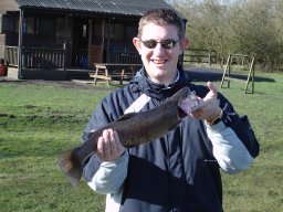 Matt Groves lands his first ever
                            rainbow trout